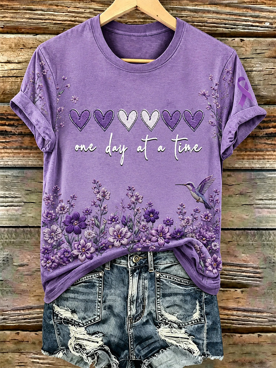 Dame-T-shirt med lilla blomster- og Alzheimers-handskermærke