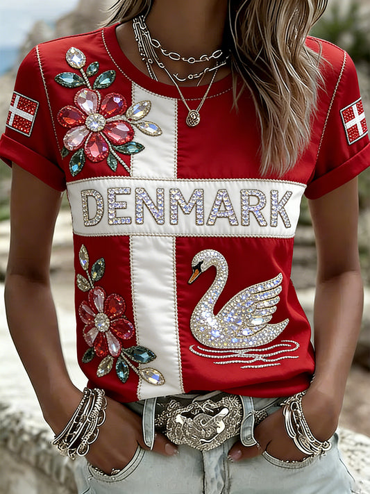 Kvinders afslappet t-shirt med blomster- og svanemotiv og ædelsten