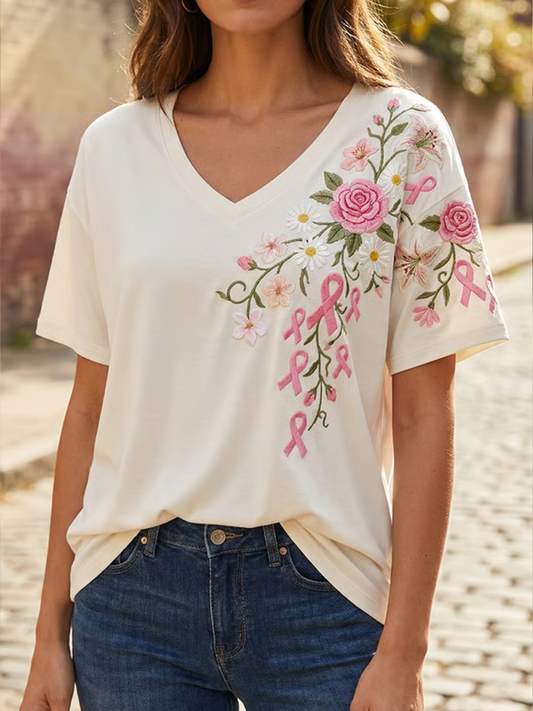 Kvinders lyserød t-shirt med blomsterprint og korte ærmer