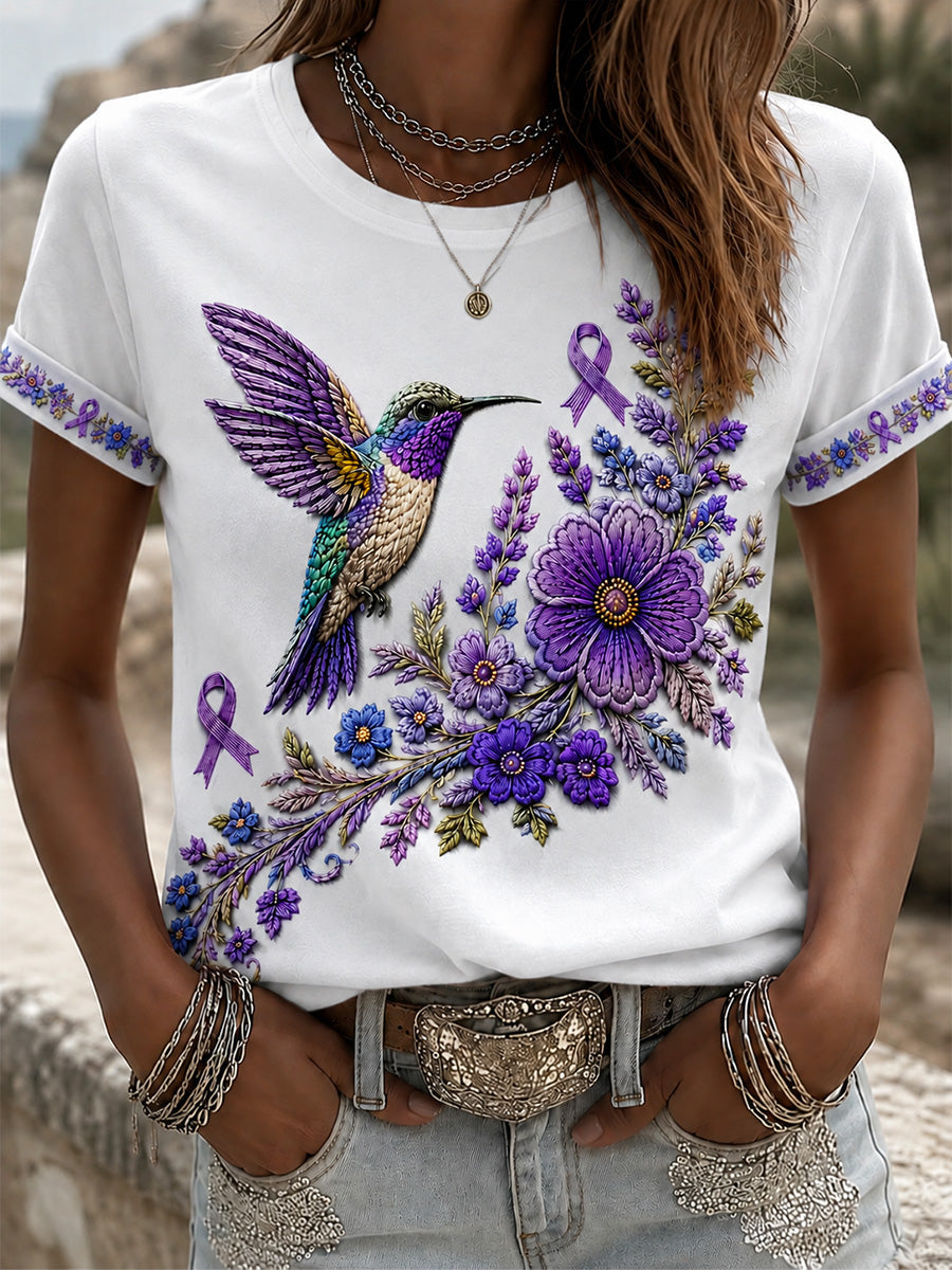 Dame-T-shirt med lilla blomster- og kolibriprint til støtte for alzheimers-ophid­sels­es­kam­pa­gnen