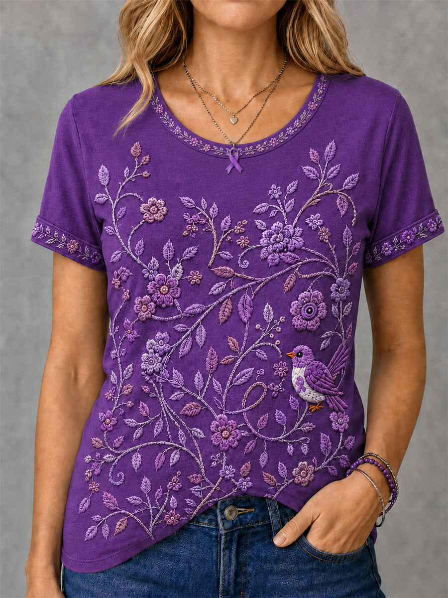 Dame-T-shirt med lilla blomster- og kolibriprint til støtte for alzheimers-ophid­sels­es­kam­pa­gnen
