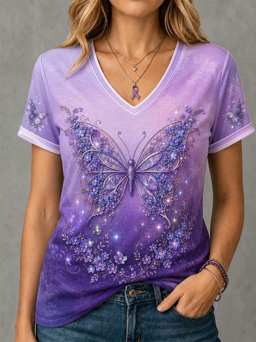 Dame-T-shirt i lilla med blomster- og sommerfugleprint, opmærksomhed omkring Alzheimers og V-udskæring til støtte for sagen