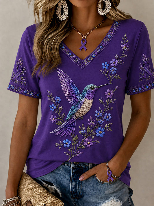 Dame-T-shirt med lilla blomster- og kolibri-print til støtte for alzheimers-indsatsen, med V-udskæring