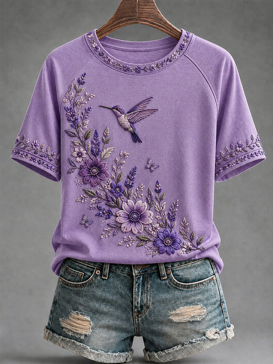 Dame-T-shirt med lilla blomster- og kolibriprint til støtte for alzheimers-ophid­sels­se