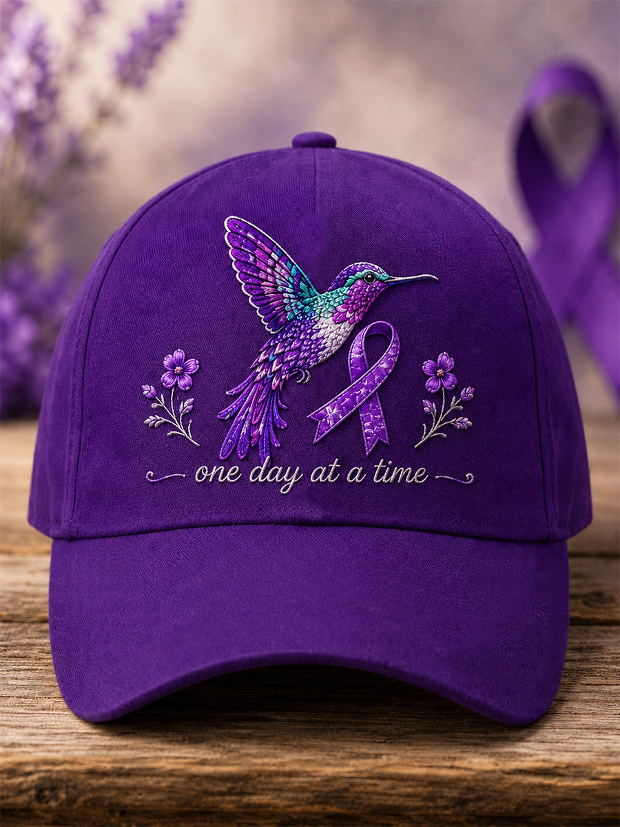 Unisex hætte med lilla blomster- og kolibriprint til støtte for alzheimersbevidsthed