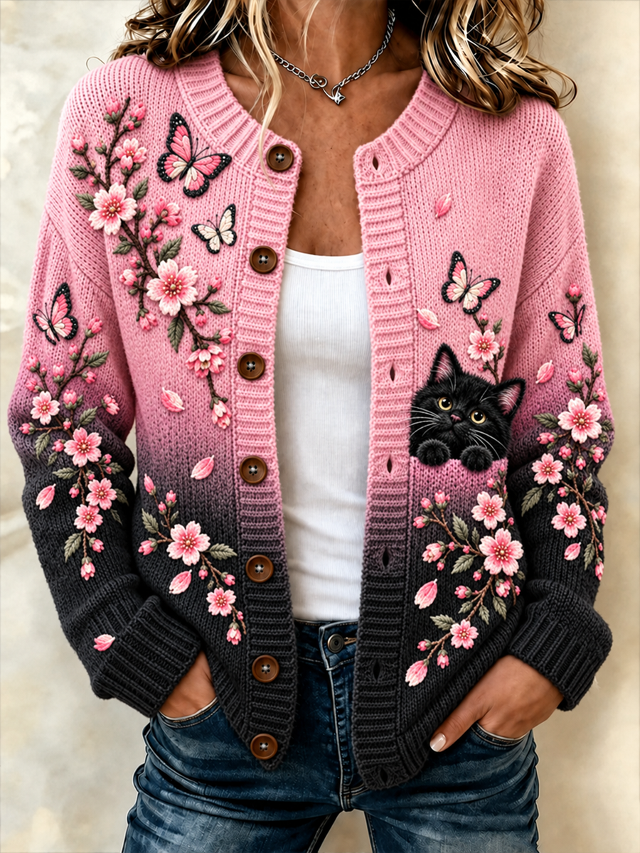 Damecardigan i sort og lyserød med katte- og blomstermønster – strikket jakke i cardigan-stil
