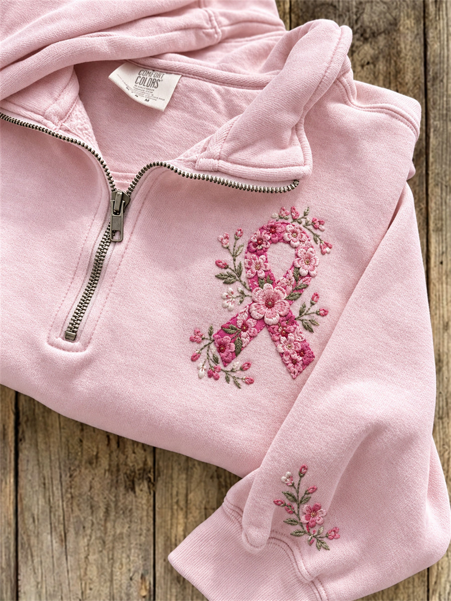 Damebluse med lyserød sløjfe, blomstermønster og lynlås